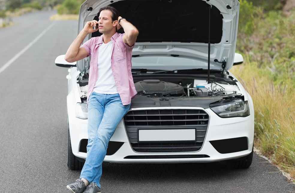 Man after car breakdown - Automakers Recalls Surge-Buyers Weigh Recall Score